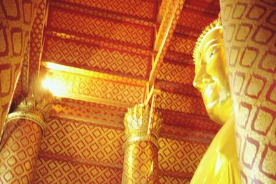 Low angle view of buddha statue in temple