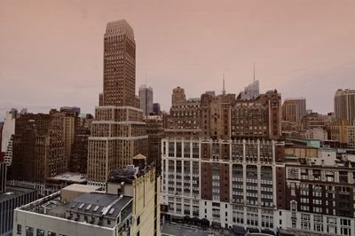 Modern buildings in city against sky