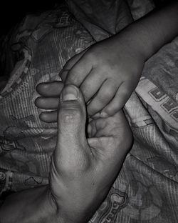 Close-up of father holding baby