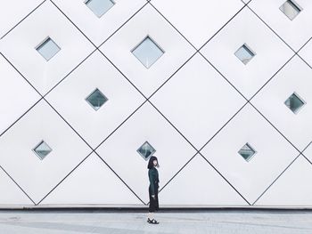 Woman walking on tiled floor