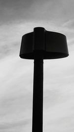 Low angle view of tower against cloudy sky