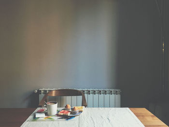 Coffee cup on table at home