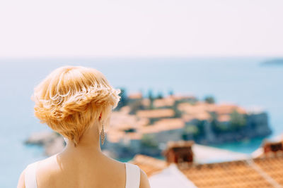 Rear view of woman looking at sea