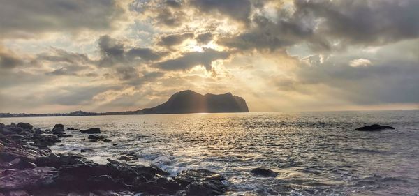 Panoramic view of sea against sky during sunset