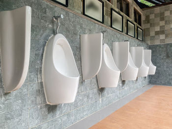 White lamps on wooden wall at home