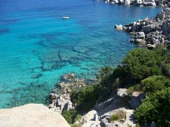 Scenic view of sea against blue sky