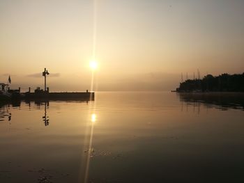 Scenic view of lake against sky during sunset