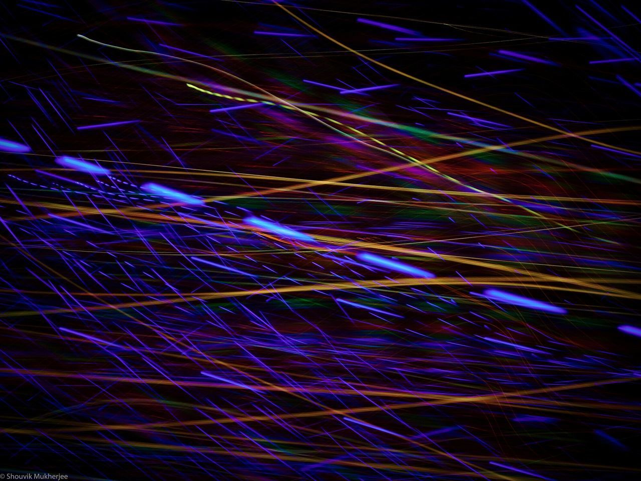 illuminated, night, multi colored, backgrounds, glowing, full frame, abstract, pattern, long exposure, lighting equipment, arts culture and entertainment, light - natural phenomenon, light trail, low angle view, light, celebration, motion, no people, outdoors, blurred motion