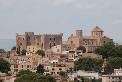 Buildings in city against sky