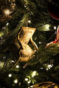 Close-up of christmas decorations hanging on tree