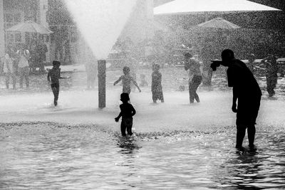 Full length of woman standing in water