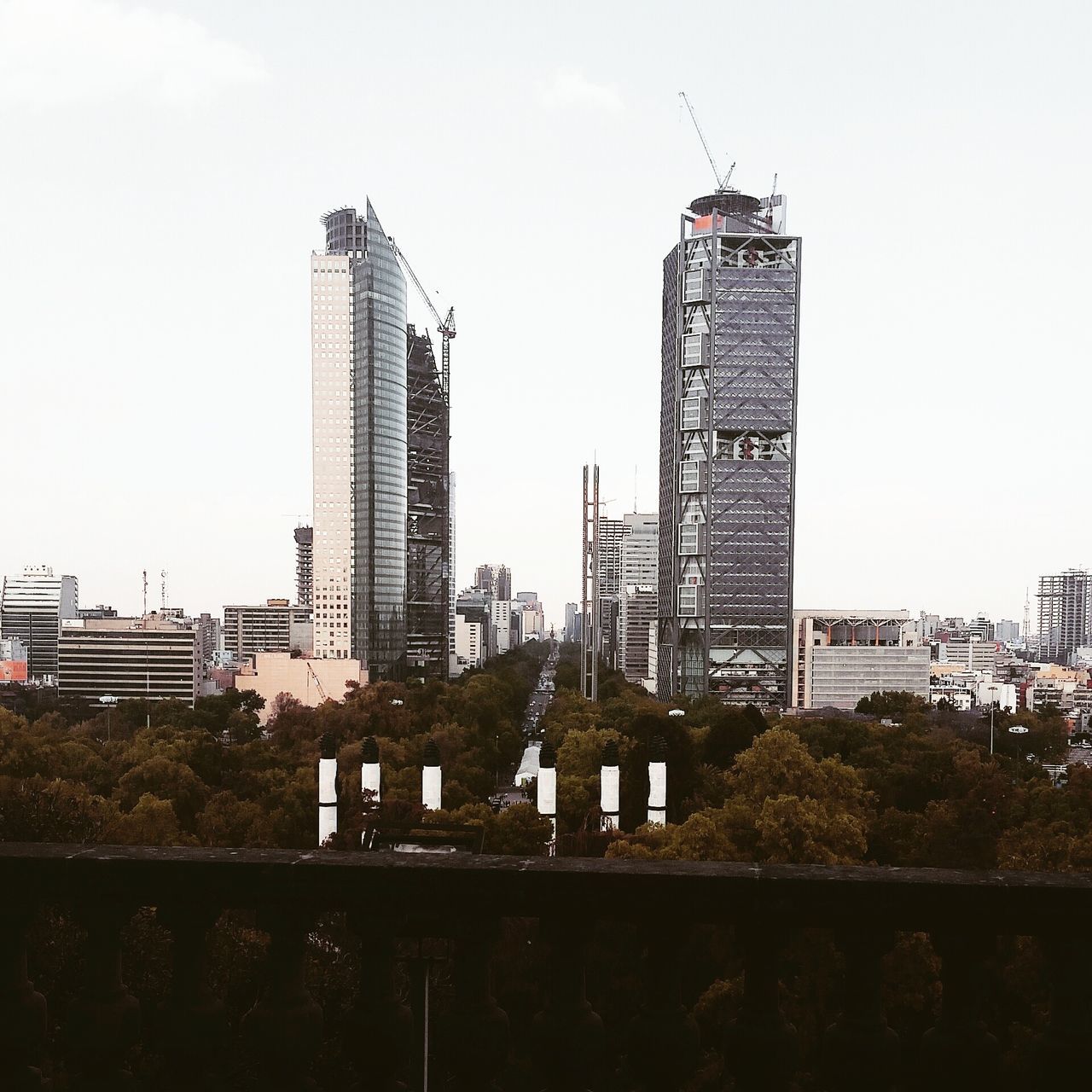 building exterior, architecture, built structure, clear sky, city, construction site, development, crane - construction machinery, tower, copy space, tall - high, construction, skyscraper, building, low angle view, day, crane, sky, office building, outdoors