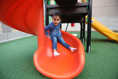 Portrait of happy boy playing in playground