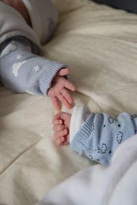 Close-up of baby sleeping on bed