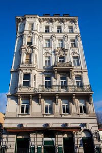 Low angle view of building against blue sky