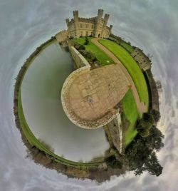 High angle view of building by lake against sky