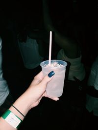 Cropped image of woman holding cold drink