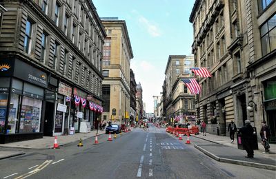 City street amidst buildings against sky