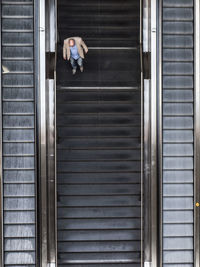 High angle view of man on escalator