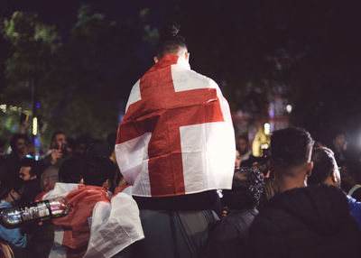 Rear view of football fans with england flag