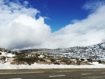 Scenic view of snowcapped mountains against sky