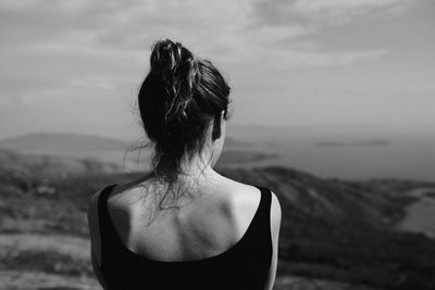 Rear view of a woman against blurred background