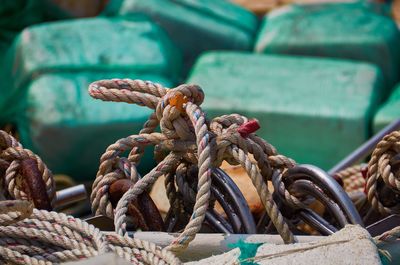Close-up of tangled rope at harbor