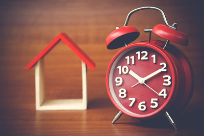 Close-up of clock on table