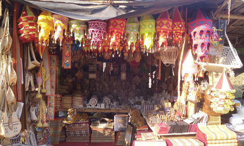 Illuminated lanterns hanging in store for sale in market