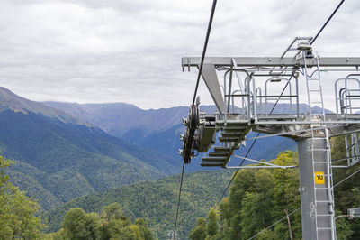 Lifts of the mountain cable car on the background of mountains