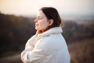 Portrait of a young woman on a sunny day in autumn