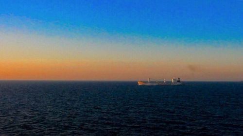 Scenic view of sea at sunset
