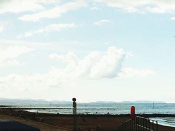 Scenic view of sea against cloudy sky