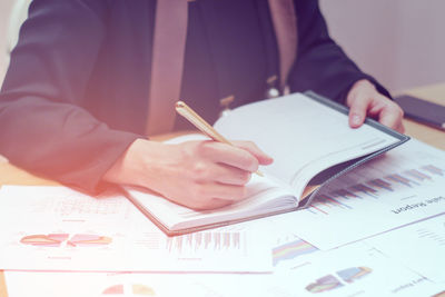 Close-up of man working on table