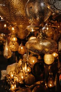 Closeup of various moroccan traditional antique lanterns and lamps hanging on local market in marrakesh city