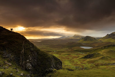 Scenic view of landscape against sky during sunset