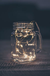 Close-up of glass jar on table