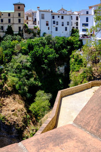 View of trees and buildings against sky