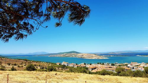 Scenic view of sea against clear blue sky