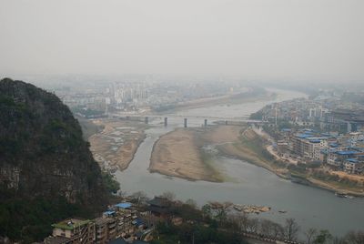 High angle view of river passing through city