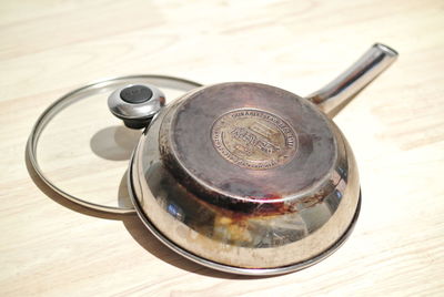 Close-up of kitchen utensil on wooden table