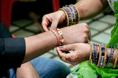 Close-up of couple holding hands