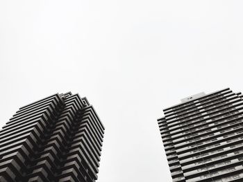 Low angle view of modern buildings against clear sky