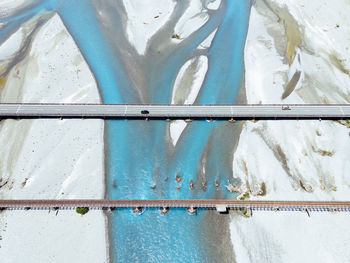 Low section of man standing on snow