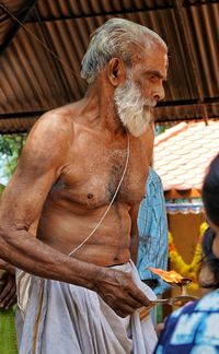 Full length of a man with arms raised outdoors