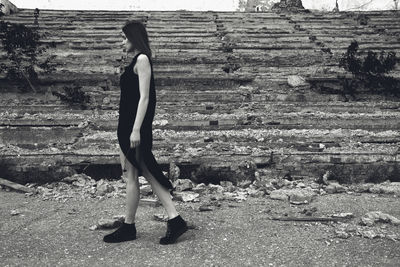 Rear view of young woman standing in park