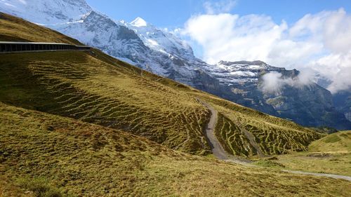 Scenic view of snowcapped mountains against sky