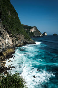 Scenic view of sea against clear blue sky