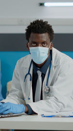 Portrait of female doctor standing in hospital