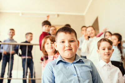 Portrait of boy with classmates